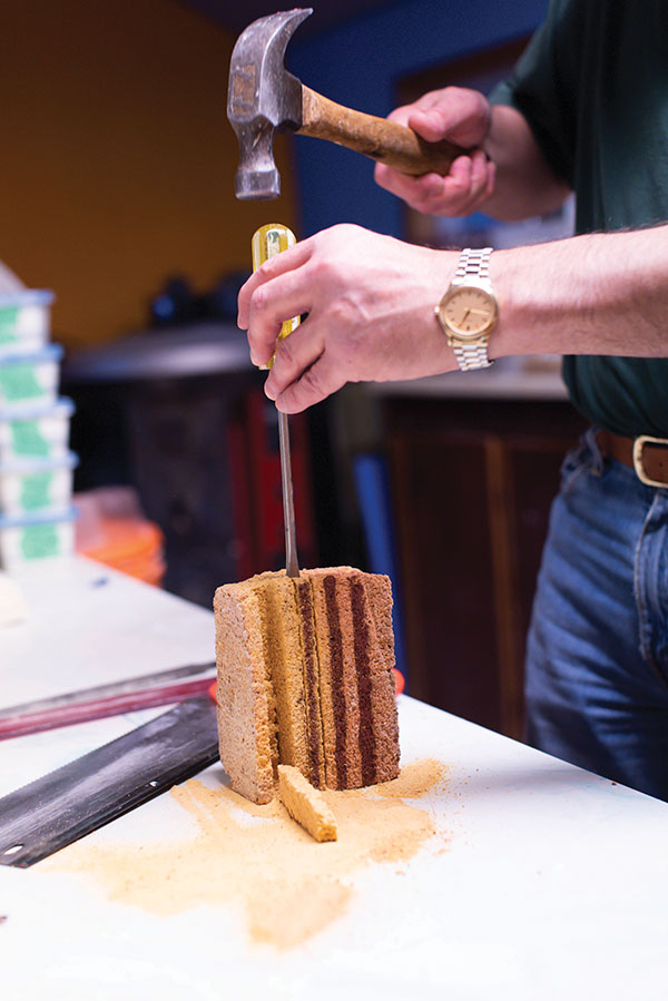 3 Gently tap out the cut sections with a flat-head screwdriver and hammer.