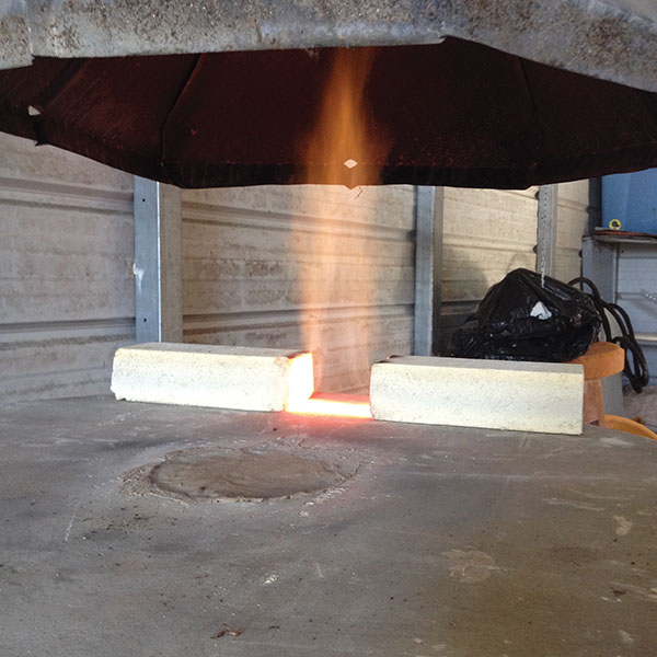 Flue exit dampened with soft brick to control the draft and reduction.