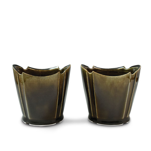 1 Dane Hodges’ whiskey sippers, 3½ in. (9 cm) in height, wheel-thrown, etched, and altered porcelain mix, glaze, fired to cone 6 in oxidation, 2019.