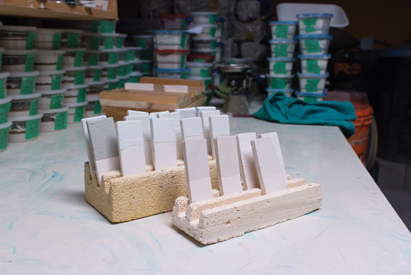 5 Glazed tiles in the soft-brick sitters awaiting the glaze firing.