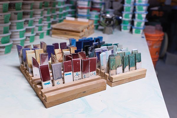 6 Fired glazed test tiles transferred to wooden stands for examination of results. 