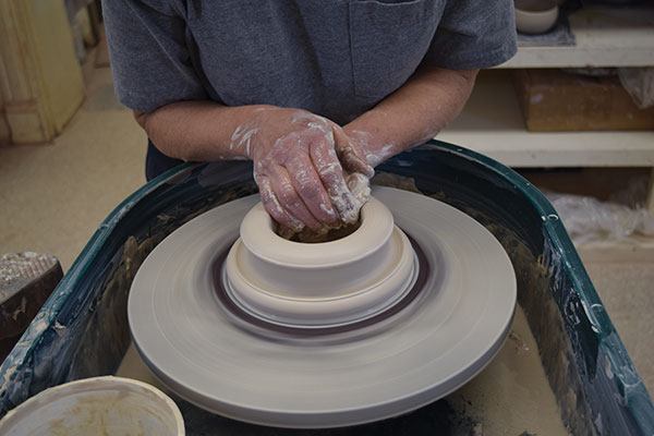2 Open the center of the clay and form a 1/4-inch-thick floor about 4 inches wide.