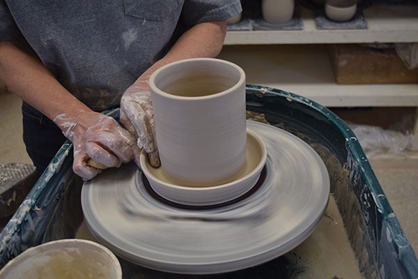 3 After pulling up the wall of the central cylinder, finish the saucer, making it at least an inch wide and an inch tall.