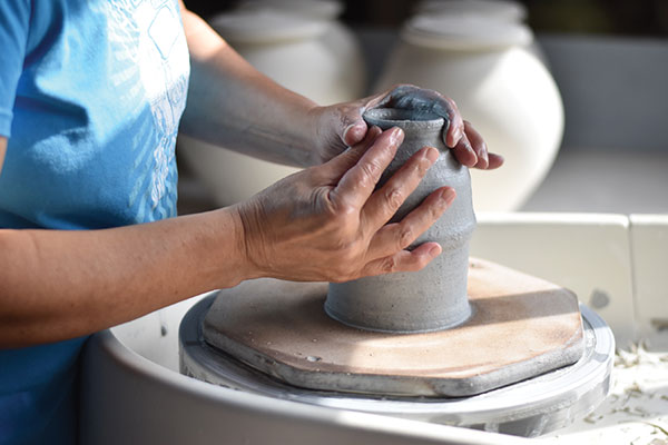 5 Center the clay on the wheel and throw a cylinder. Collar in the top. 