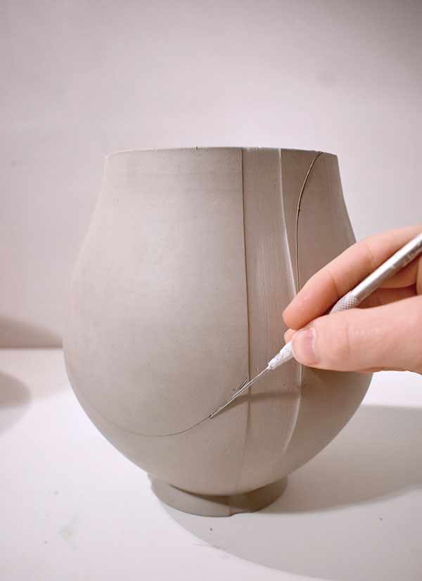6 Use soft pressure and your angled needle tool to mark the opening of the basket. 