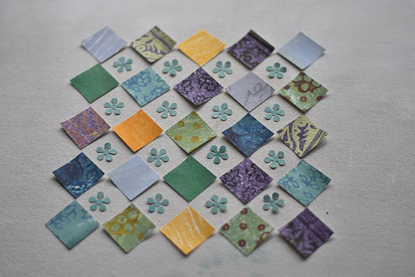 12 Lay out the cut paper shapes to create a pattern reminiscent of a quilt. 