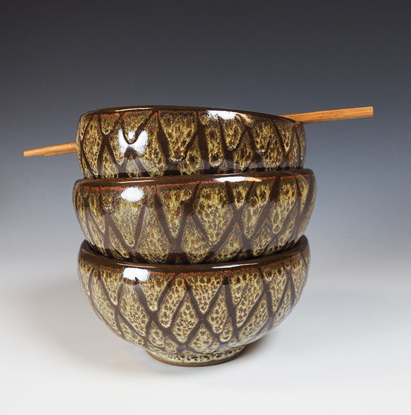 3 Noodle bowls with Tony Hansen’s G2934 base +5% Zircopax over Sankey Red. Wax-resist decoration applied after first glaze layer.