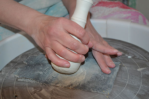 9 Smooth the rasped edges of the pestle with drywall sanding screen.