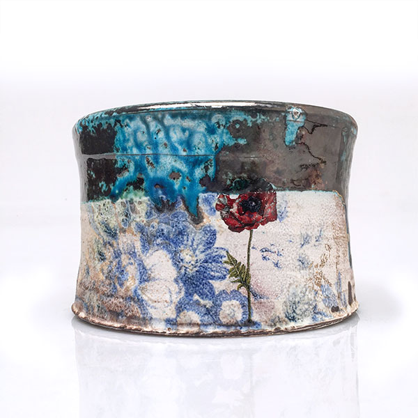 Justin Rothshank’s planter, 6 1/2 in. (17 cm) in diameter, wheel-thrown earthenware, soda fired to cone 3, refired to cone 015 with various decals, refired again in a soda kiln to cone 3, refired again with various commercial decals to cone 015, 2019.