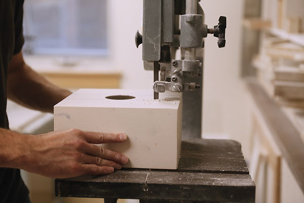 3 Cut the plaster molds on a band saw; follow the cutting paths drawn on the plaster to create several parts.