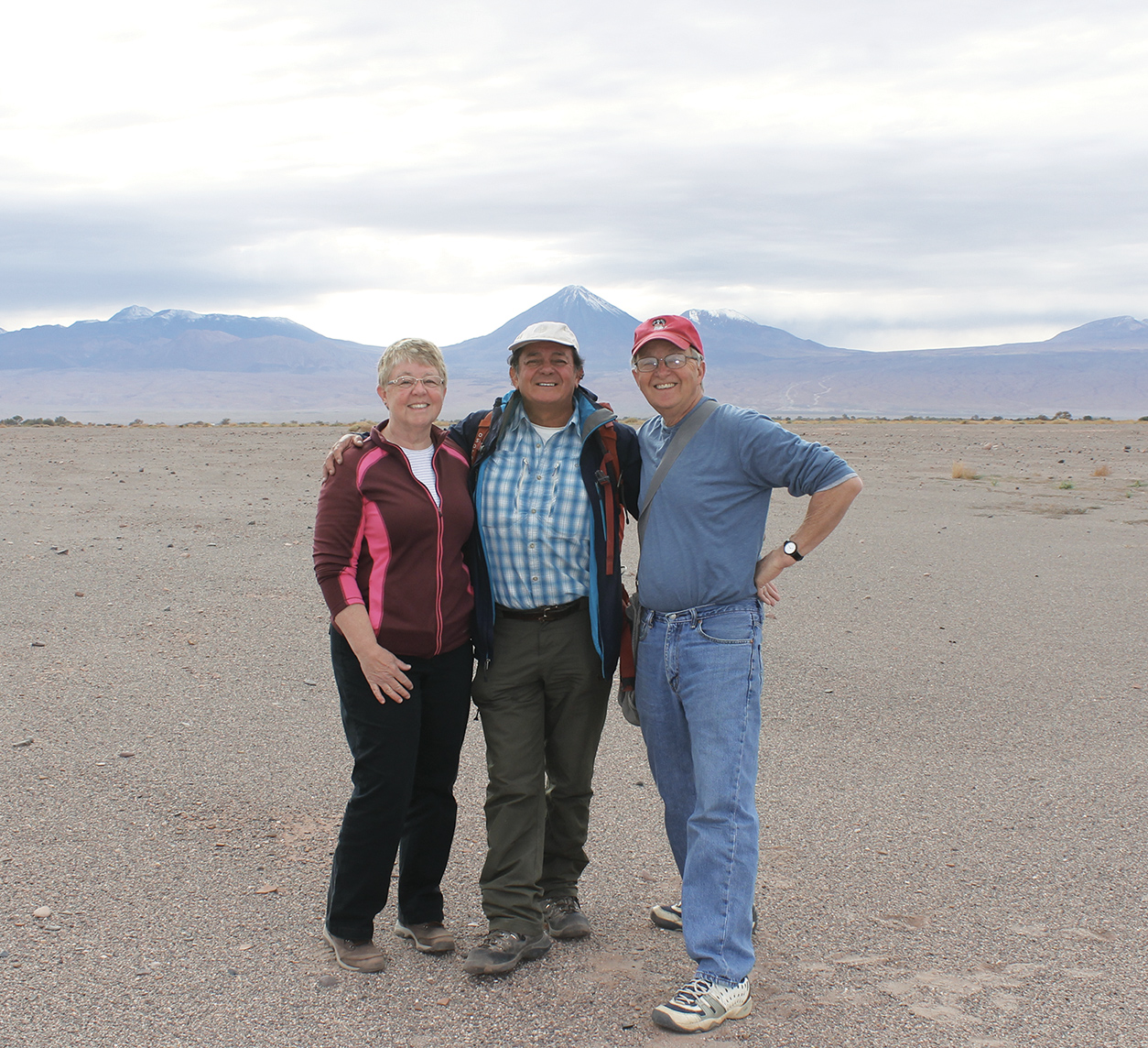1 Carol, Luis Aracena, and Craig at a Pre-Columbian site near San Pedro de Atacama with the Andes Mountains in the background, 2017. 