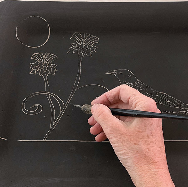 5 Carve in decorative elements behind your primary image with the same etching tool.