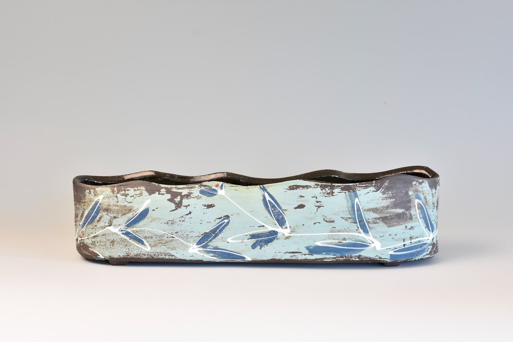 Katrin Huerzeler, Vase #2 from the series: Dancing Leaves, 12 in. (31 cm) in height, wheel-thrown and handbuilt, black clay, clear glaze on the interior, terra sigillata, colored slips, underglazes on the exterior, fired to cone 6, 2020.  www.khceramicdesign.com