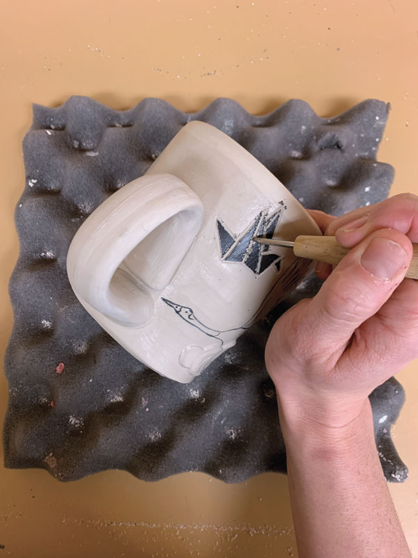 8 Apply wax over the cup’s exterior, then carve details through the dried wax.