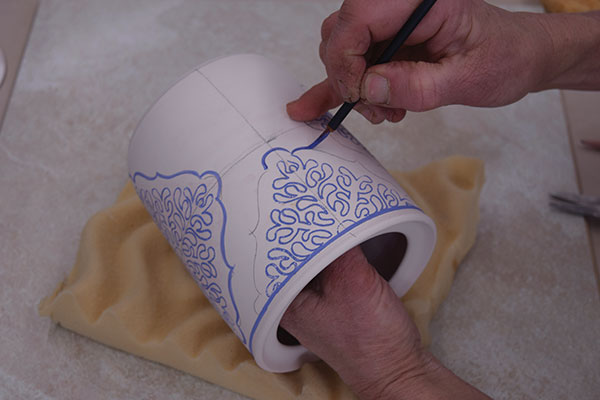 10 Once the decals are dry, use a fine brush to hand-paint additional decoration.