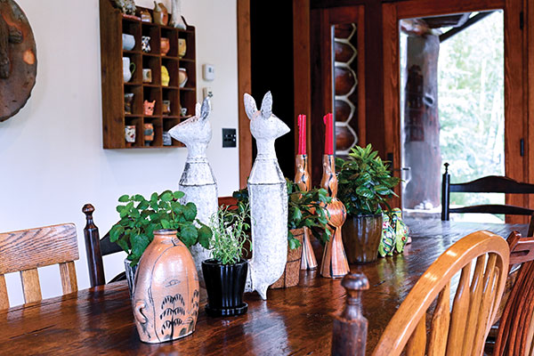 2 Dining room table display that changes often, featuring from left to right: Matt Metz’ bottle, Candice Methe’s sculpture, Suze Lindsay’s candelabra, and a salt-and-pepper collaboration by Tara Wilson and Rosalie Wynkoop.