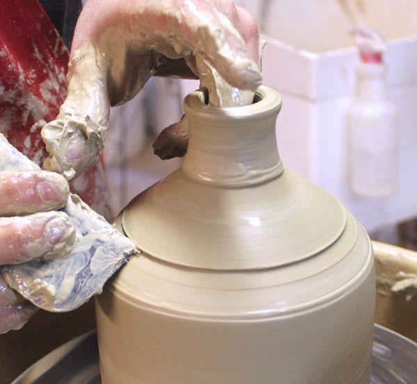 11 Establish another line about 3/4 inch above the shoulder of the jug.