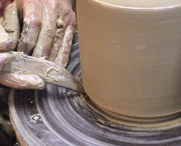 12 Bevel the bottom of the jug with a wooden fettling knife.