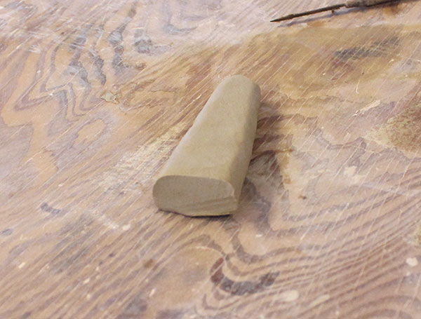 14 Roll out a small piece of clay, about half the size of a small carrot.