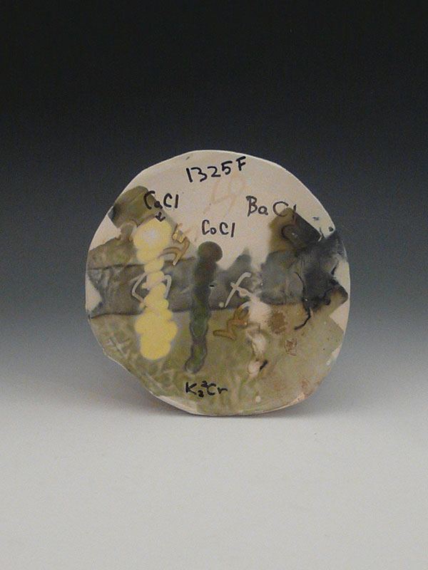 1 A 5-inch-diameter test tile: calcium chloride is the yellow stripe on the left side. 