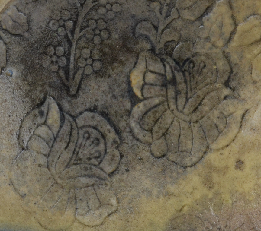 6 Porcelain bowl with Pale Peach terra sigillata over low-relief surface decoration.