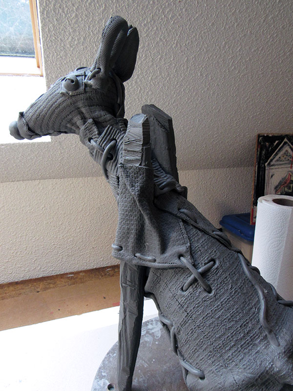 8 Add extruded clay coils to simulate larger stitching. At this point, the building is almost complete.