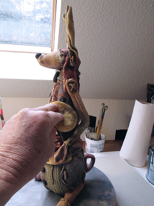 15 Carefully wipe away some of the dark stain to create contrast and to mute or tone down the color.