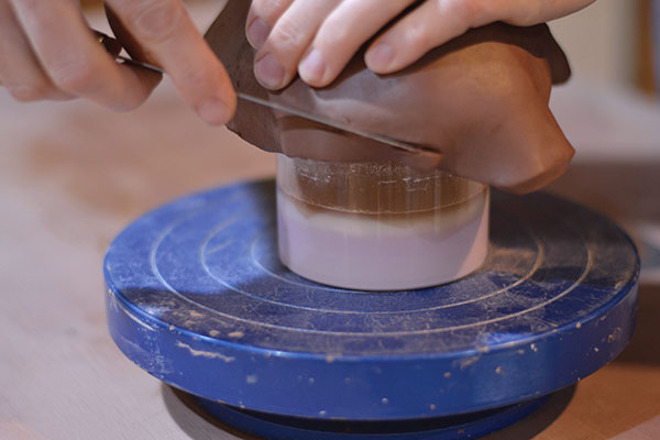 3 Trim away the excess slab using a fettling knife.                                                 