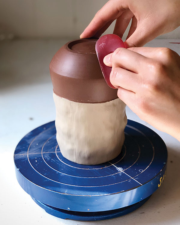 7 Compress the bare clay with a soft rubber rib to smooth out any imperfections. 