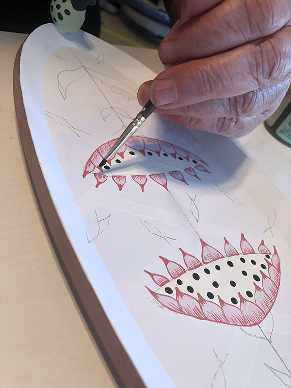 10 Add black dots inside the flower. These will act as the base for the raised areas.