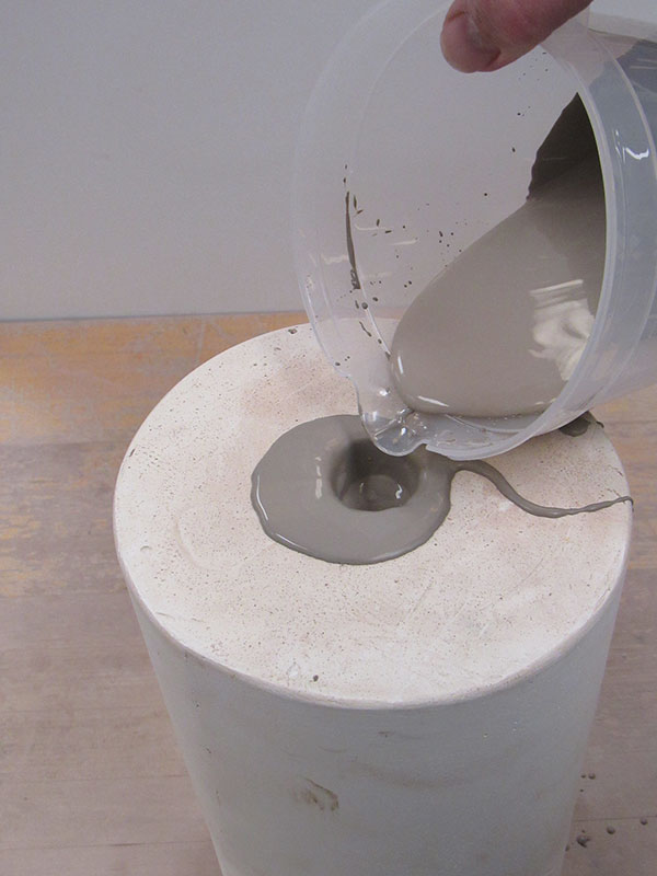 7 Add more slip as the plaster pulls water from the cast.