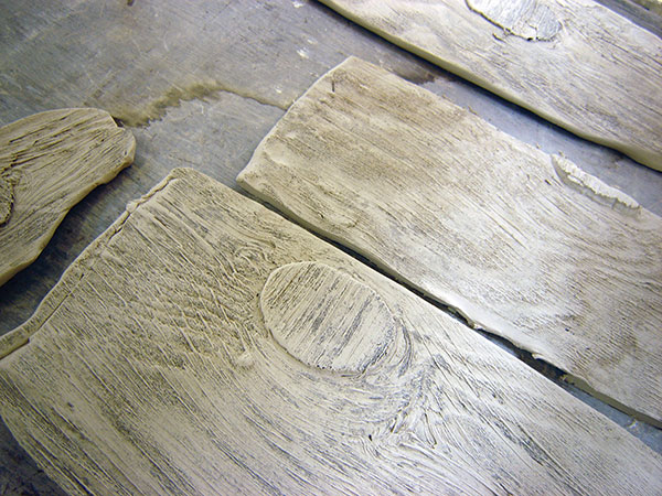 3 Various pressings from wood fences, shutters, and buildings showing wood grain and knots.