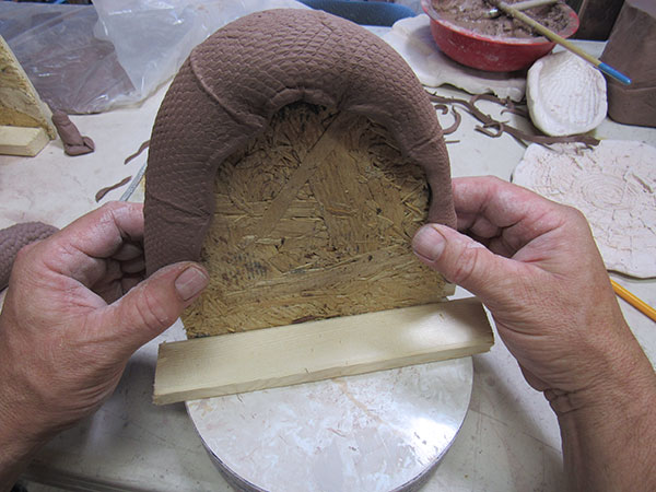 14 Drape a handle over a cut plywood handle stand to firm up. 