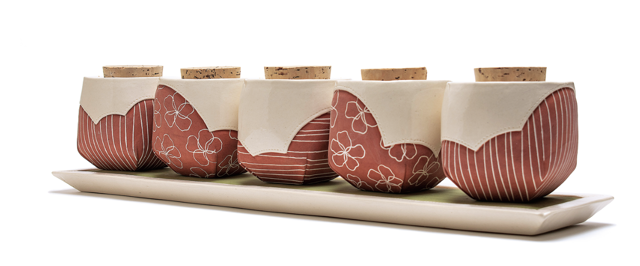 3 Marissa Childers’ spice jars, 17 in. (43 cm) in length, white earthenware, underglaze, clear glaze, 2019.