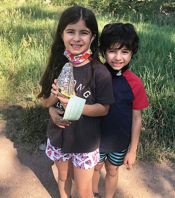 5 Penny and Jack work together to find a bird along the Coal Creek Trail near Ryan Elementary School.