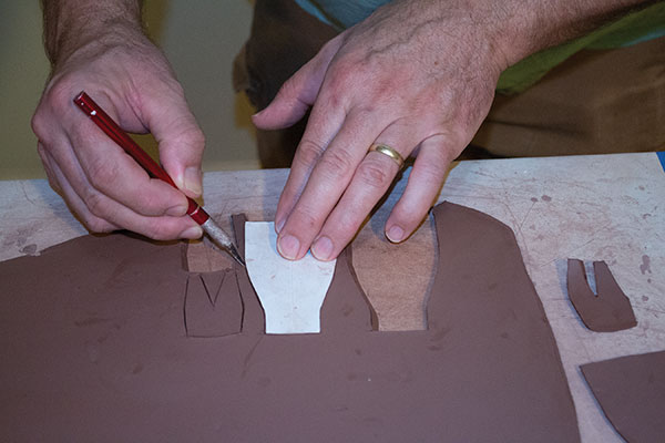 8 Use templates to cut the scoop components from a slab of clay.