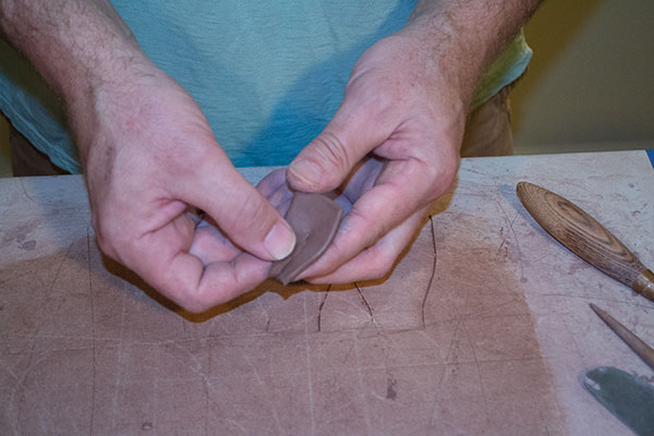 9 Score, add slip, then join the dart to create the curve, and finish shaping the scoop.