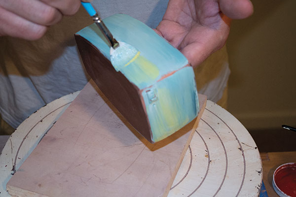 12 Layer over the turquoise underglaze with strokes of yellow underglaze to add warmth.