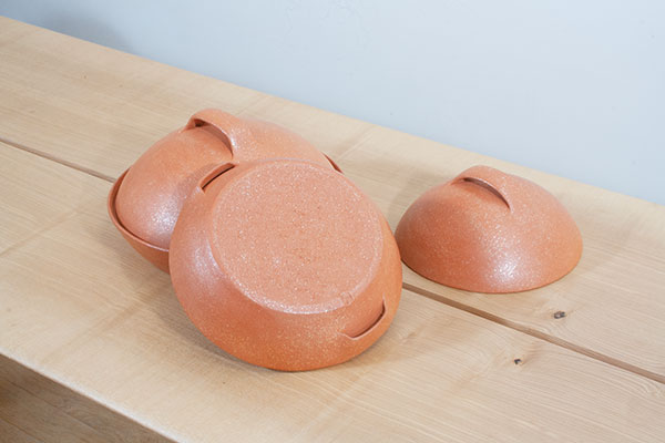 Two bread cloches, one inverted to show the base as well as the underside of the handles, 2020.
