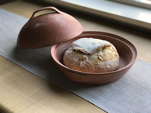 Small bread cloche shown in use.