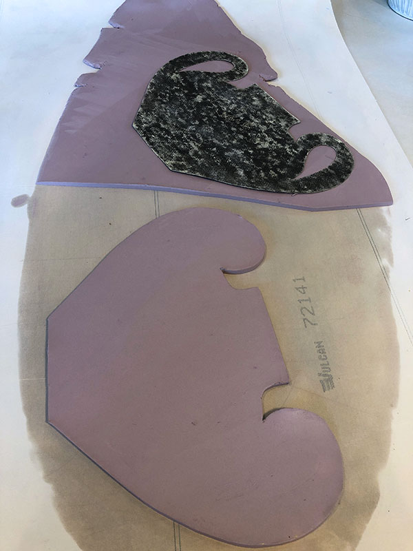 1 Roll a slab and cut out the front and back of the vase using a template.