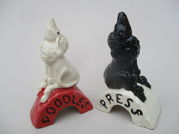 7 Two glazed pie poodles, showing variations made by adding words or texture to the base as well as choosing color schemes that make each one unique.