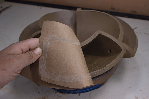17 Pierce holes in any enclosed spaces for air and moisture to escape. Next, create unique templates by wetting the edges of the slabs then press a piece of paper covering the area intended for the new slab. Pull the paper away to reveal an outline made of water and slip in the shape of the next slab.