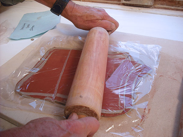 6 Roll these pieces together under plastic with a rolling pin.