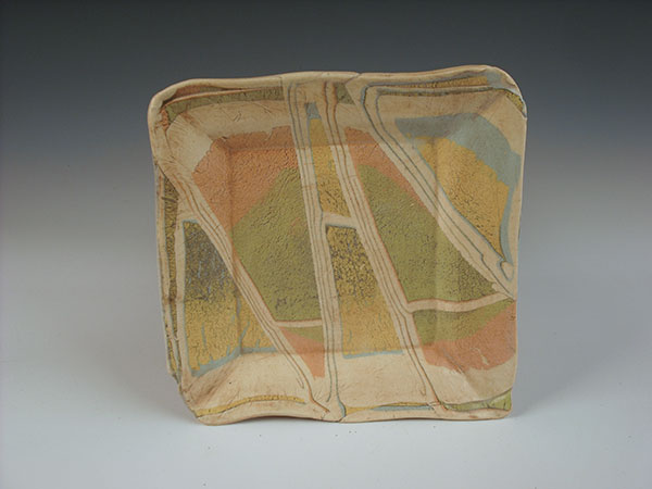 Plate, 10 in. (25 cm) in length made from 2 alternating slabs, 2020. All pieces are cone-5 colored clay.