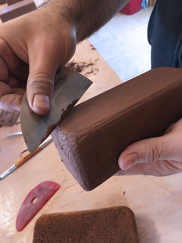 4 Clean and smooth the outside of your hollow box with a flexible metal or rubber rib.
