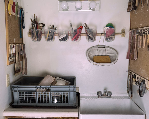 4 Tools hung or stored in 1-liter measuring cups and drying rack. This minimizes build up of clay residue at the bottom of containers.