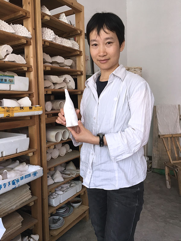 1 Kaie Fu with one of her porcelain vases.