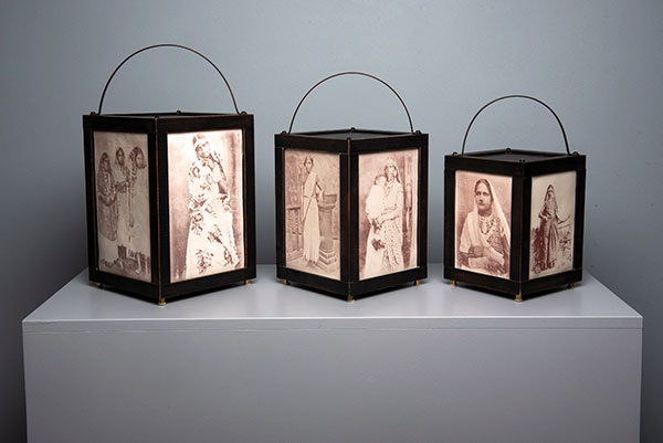 6 Illuminated (detail, 3 of 15 lanterns), to 10 in. (25 cm) in height, hand-pressed low-fire porcelain tiles, iron-oxide ceramic decals, wood, metal, LED fixture, 2020. Photo: Dale Roddick.
