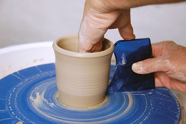 1 The template held against a basic cylindrical form.